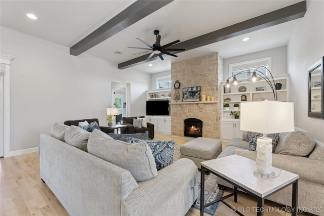 19340 E Canyon Ridge Rd, Owasso, OK 74055 - living room with recessed lighting, a stone fireplace, beamed ceiling, light wood-type flooring, and ceiling fan