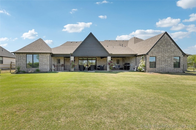 19340 E Canyon Ridge Rd, Owasso, OK 74055 - rear view of property featuring brick siding, a yard, and roof with shingles