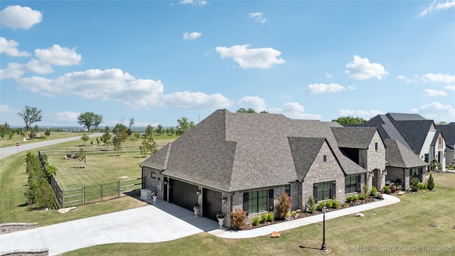 19340 E Canyon Ridge Rd, Owasso, OK 74055 - exterior space with fence, roof with shingles, a front yard, and concrete driveway