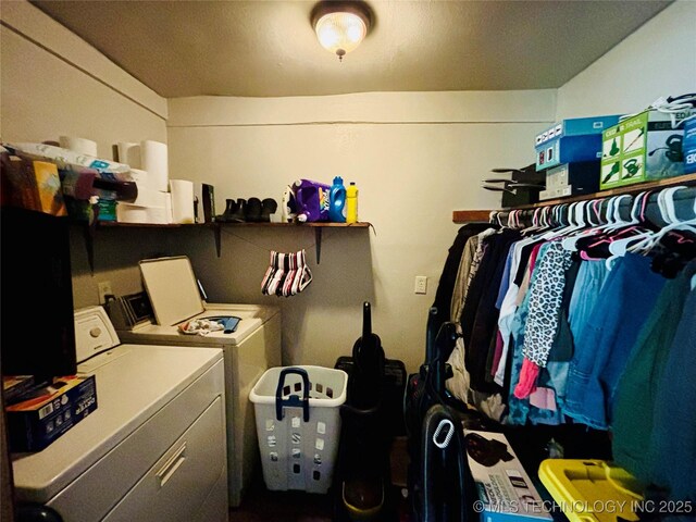 laundry room with washer and dryer and laundry area