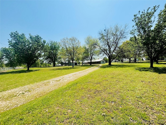 view of property's community with a lawn
