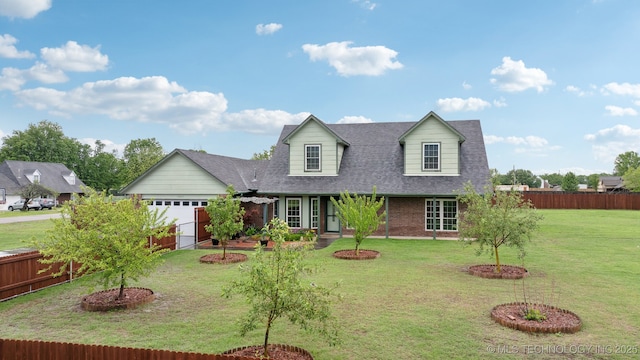 15015 E 74th Pl, Owasso, OK 74055 - cape cod-style house with an attached garage, brick siding, and a shingled roof