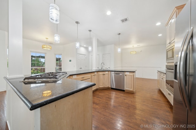15015 E 74th Pl, Owasso, OK 74055 - kitchen featuring appliances with stainless steel finishes, a sink, dark wood-style floors, light brown cabinets, and recessed lighting