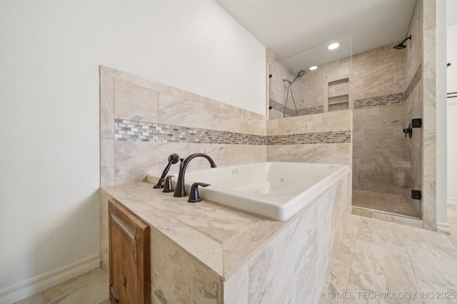 15015 E 74th Pl, Owasso, OK 74055 - full bath with a shower stall, a whirlpool tub, and tile walls