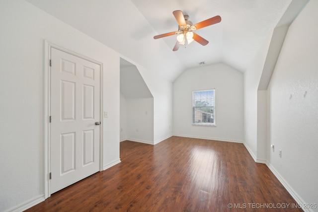 bonus room with a ceiling fan, baseboards, wood finished floors, lofted ceiling, and visible vents
