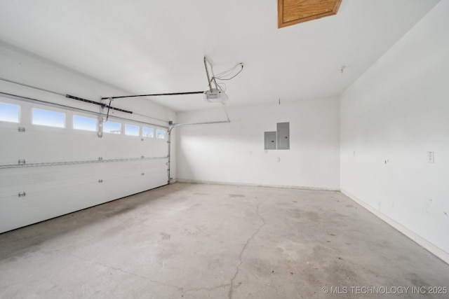 15015 E 74th Pl, Owasso, OK 74055 - garage featuring electric panel and a garage door opener