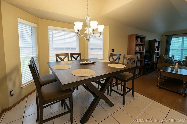 3701 Bridgeport Rd, Norman, OK 73072 - dining room with a chandelier, lofted ceiling, and light tile patterned flooring