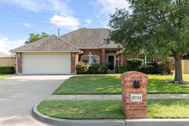 3701 Bridgeport Rd, Norman, OK 73072 - view of front facade featuring a garage, a front yard, driveway, and brick siding