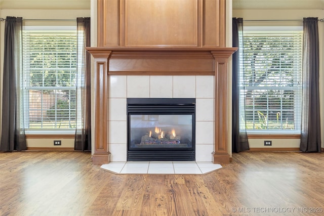 3701 Bridgeport Rd, Norman, OK 73072 - detailed view of wood finished floors and a fireplace
