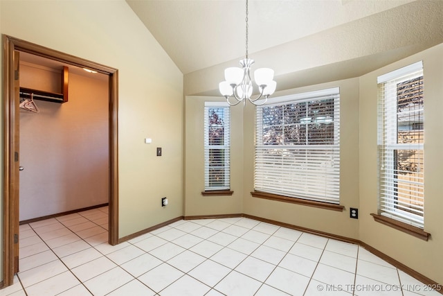 3701 Bridgeport Rd, Norman, OK 73072 - unfurnished dining area featuring a chandelier, lofted ceiling, plenty of natural light, and light tile patterned flooring