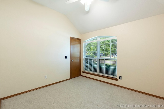 3701 Bridgeport Rd, Norman, OK 73072 - unfurnished room featuring vaulted ceiling, a ceiling fan, and light carpet