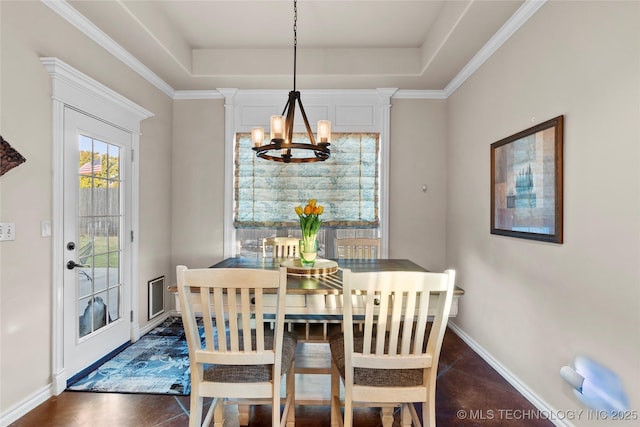 12330 S Ash Ave, Jenks, OK 74037 - dining room featuring a chandelier, a raised ceiling, baseboards, and dark tile patterned flooring