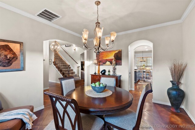 12330 S Ash Ave, Jenks, OK 74037 - dining area featuring arched walkways, a chandelier, stairway, ornamental molding, and baseboards