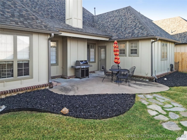 12330 S Ash Ave, Jenks, OK 74037 - back of property with a patio, fence, roof with shingles, and board and batten siding