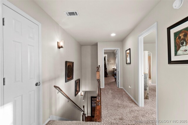 12330 S Ash Ave, Jenks, OK 74037 - corridor with an upstairs landing, carpet, arched walkways, and baseboards