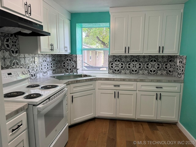 kitchen with white cabinetry, light countertops, under cabinet range hood, white electric stove, and dark wood finished floors