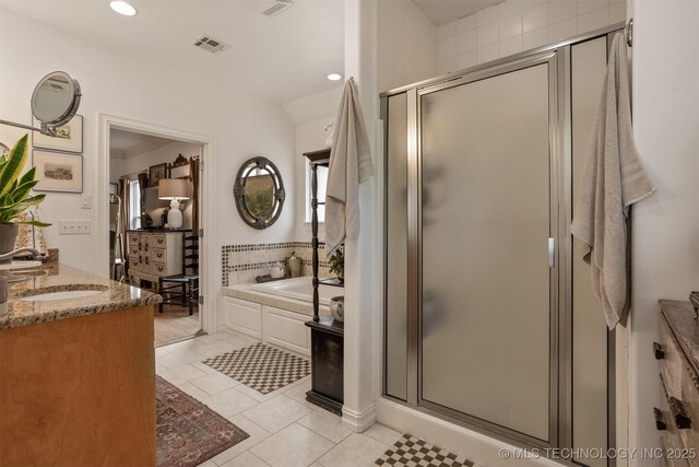 461 Cross Timbers Blvd, Sapulpa, OK 74066 - bathroom featuring tile patterned floors, visible vents, a bath, and a stall shower