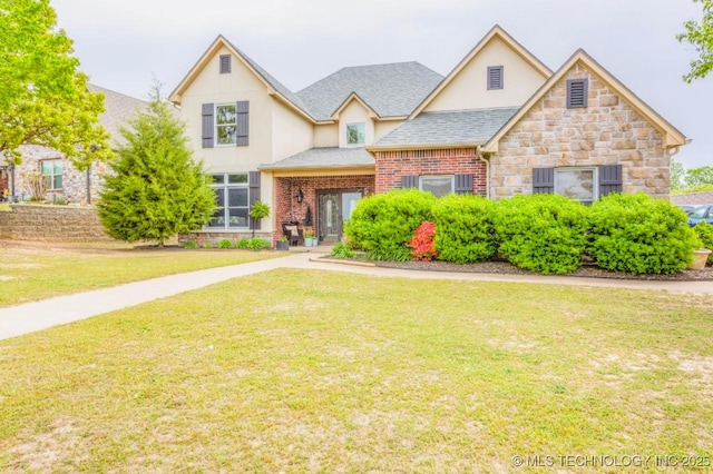 461 Cross Timbers Blvd, Sapulpa, OK 74066 - view of front of home with a front lawn, stone siding, a shingled roof, and stucco siding