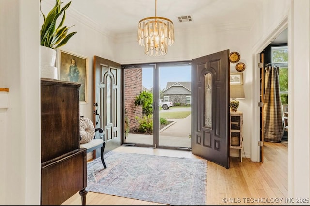 461 Cross Timbers Blvd, Sapulpa, OK 74066 - foyer featuring a chandelier, visible vents, wood finished floors, and plenty of natural light