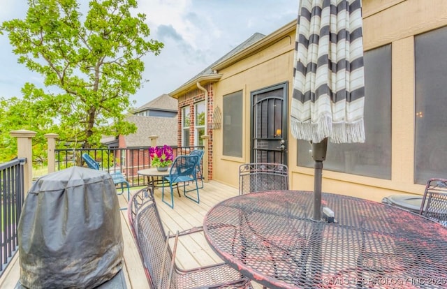 461 Cross Timbers Blvd, Sapulpa, OK 74066 - wooden terrace featuring outdoor dining space and area for grilling