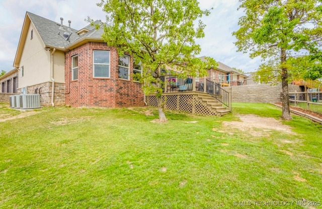 461 Cross Timbers Blvd, Sapulpa, OK 74066 - view of yard with fence, a wooden deck, central AC unit, and stairs