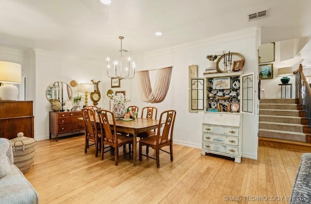 461 Cross Timbers Blvd, Sapulpa, OK 74066 - dining space with stairway, a notable chandelier, crown molding, visible vents, and light wood-style flooring
