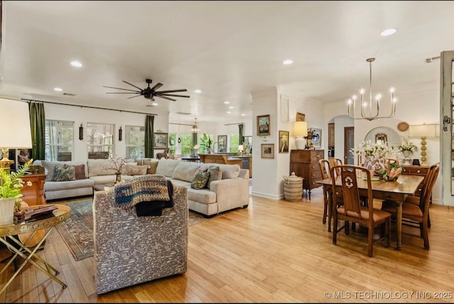 461 Cross Timbers Blvd, Sapulpa, OK 74066 - living area featuring ceiling fan with notable chandelier, recessed lighting, light wood-style flooring, and arched walkways