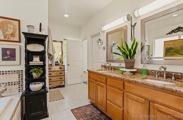 461 Cross Timbers Blvd, Sapulpa, OK 74066 - bathroom with tile patterned floors, a washtub, double vanity, and a sink