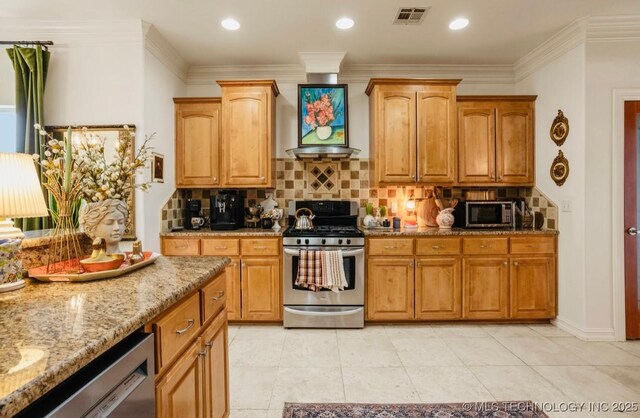 461 Cross Timbers Blvd, Sapulpa, OK 74066 - kitchen with light tile patterned floors, decorative backsplash, visible vents, stainless steel appliances, and light stone countertops