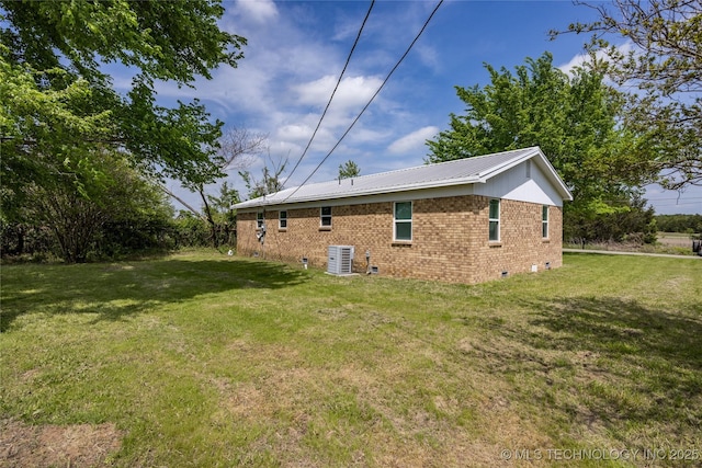 647 Sawmill Rd, Durant, OK 74701 - rear view of property with cooling unit, crawl space, a lawn, brick siding, and metal roof