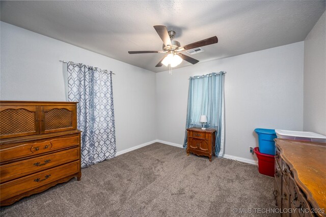 647 Sawmill Rd, Durant, OK 74701 - carpeted bedroom with baseboards, visible vents, and ceiling fan