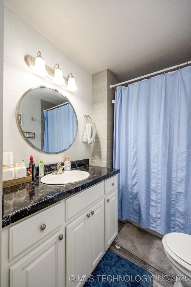 647 Sawmill Rd, Durant, OK 74701 - bathroom featuring vanity and toilet