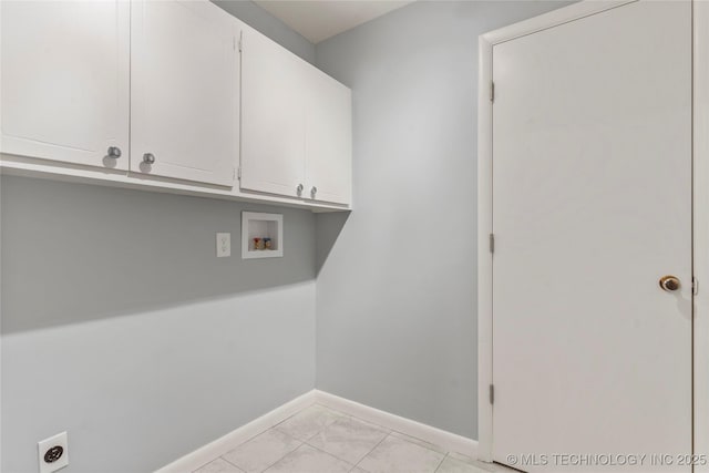 laundry area featuring baseboards, washer hookup, cabinet space, and electric dryer hookup