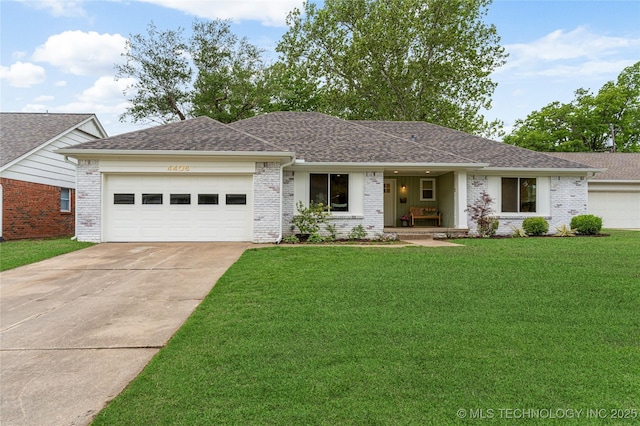 single story home with roof with shingles, an attached garage, a front lawn, brick siding, and concrete driveway