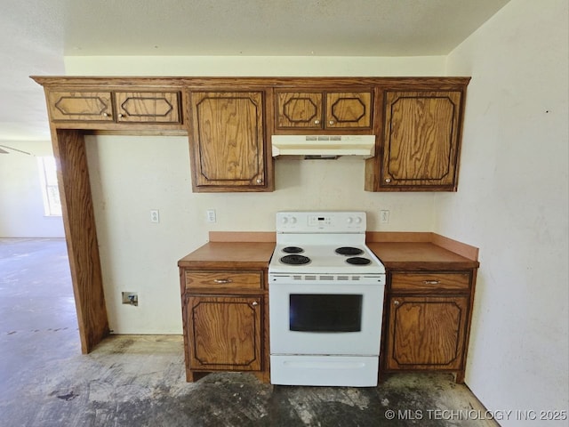 kitchen featuring white electric range oven, brown cabinets, under cabinet range hood, and dark countertops