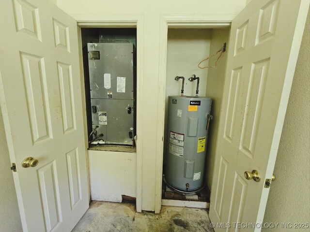 utility room with heating unit and electric water heater