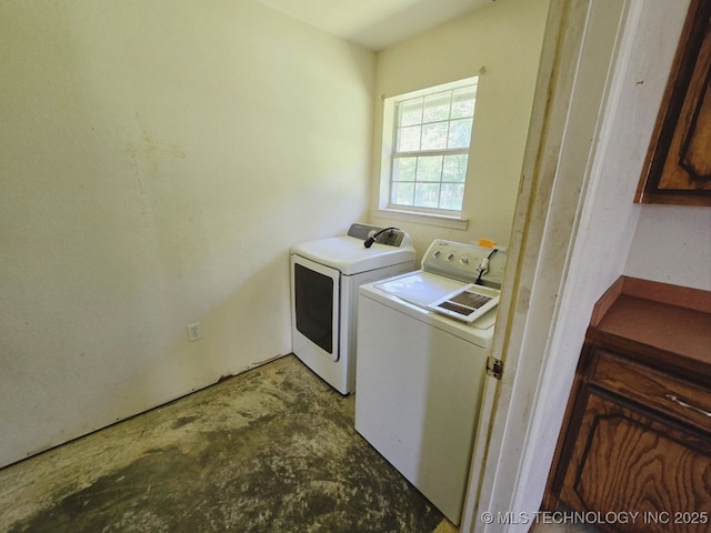 laundry area with washing machine and clothes dryer and laundry area