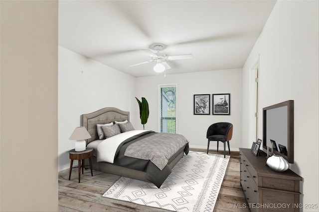 bedroom with a ceiling fan, baseboards, and wood-type flooring
