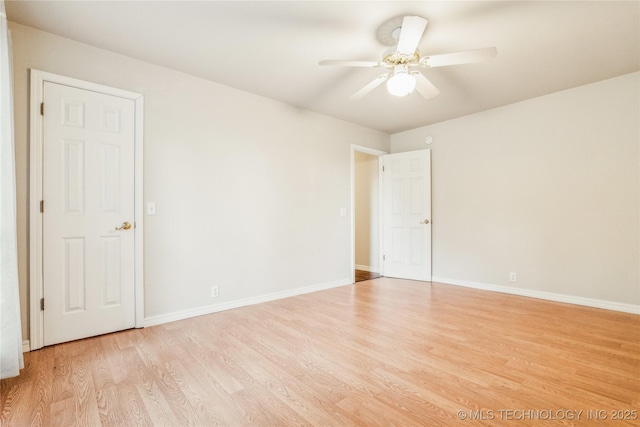 21083 Stick Ross Mountain Rd, Tahlequah, OK 74464 - empty room with light wood finished floors, ceiling fan, and baseboards