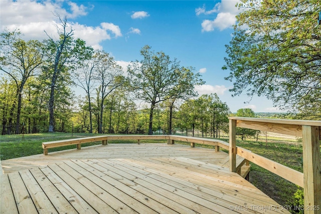 wooden deck featuring fence