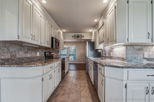 21083 Stick Ross Mountain Rd, Tahlequah, OK 74464 - kitchen with stainless steel appliances, a sink, white cabinetry, recessed lighting, and backsplash