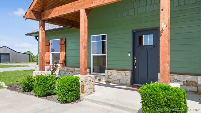 9153 S 4270th Rd, Chelsea, OK 74016 - doorway to property featuring stone siding