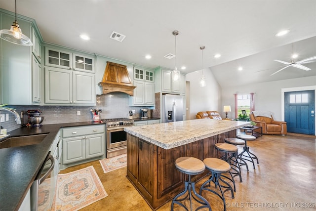 9153 S 4270th Rd, Chelsea, OK 74016 - kitchen featuring stainless steel appliances, visible vents, a sink, premium range hood, and decorative backsplash