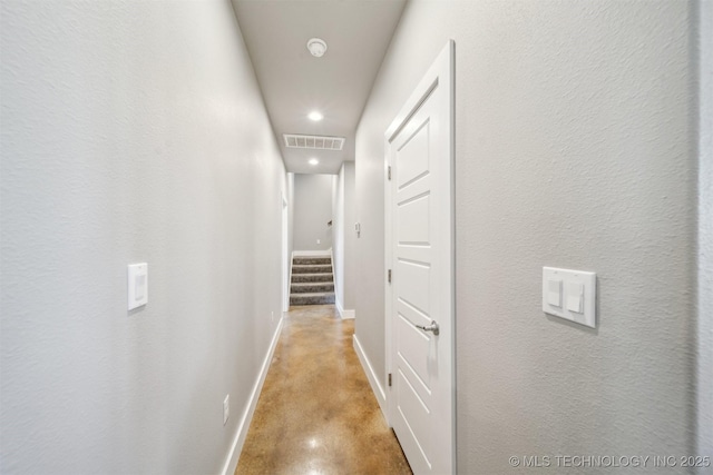 9153 S 4270th Rd, Chelsea, OK 74016 - corridor featuring concrete floors, baseboards, visible vents, and recessed lighting