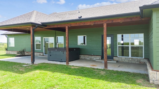 9153 S 4270th Rd, Chelsea, OK 74016 - back of house featuring a yard, a hot tub, and a patio