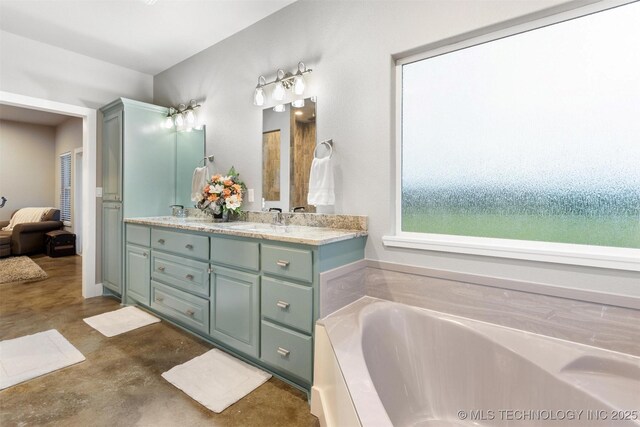 9153 S 4270th Rd, Chelsea, OK 74016 - full bath with a sink, double vanity, a bath, and finished concrete floors