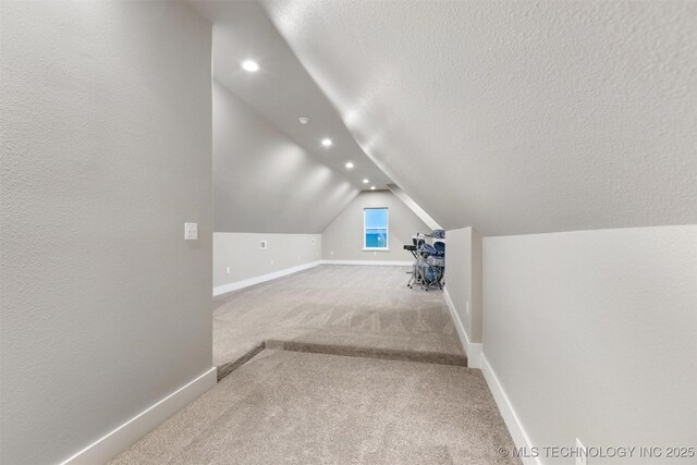 9153 S 4270th Rd, Chelsea, OK 74016 - additional living space with recessed lighting, carpet floors, a textured ceiling, and vaulted ceiling