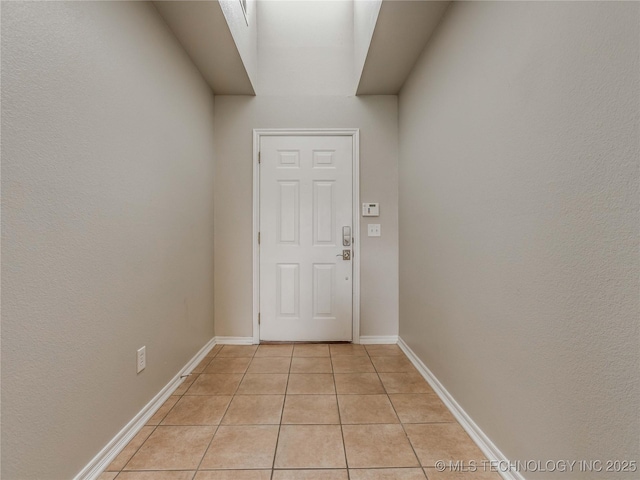 12520 S Birch Ave, Jenks, OK 74037 - doorway to outside with light tile patterned flooring and baseboards