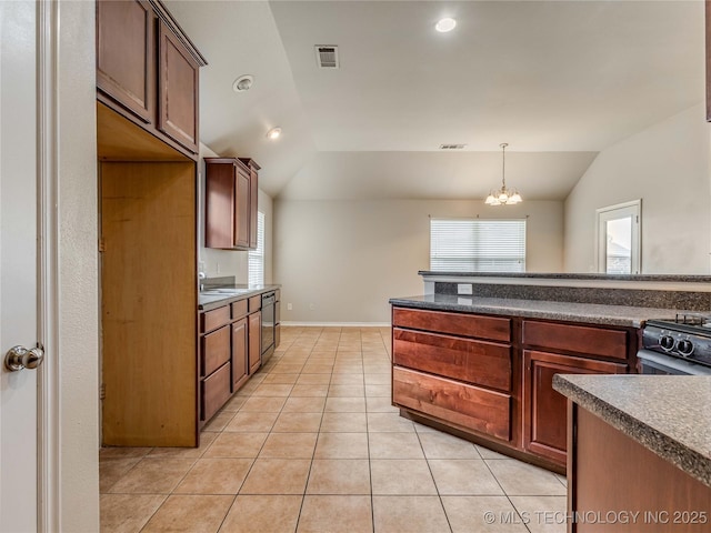 12520 S Birch Ave, Jenks, OK 74037 - kitchen featuring vaulted ceiling, gas stove, dark countertops, light tile patterned flooring, and a chandelier