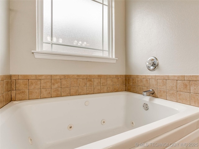 12520 S Birch Ave, Jenks, OK 74037 - bathroom featuring a whirlpool tub and plenty of natural light